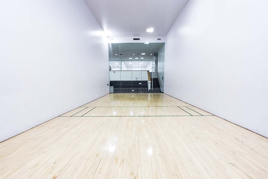 Photo of Squash & Raquetball Courts from back of court looking out towards the glass windows